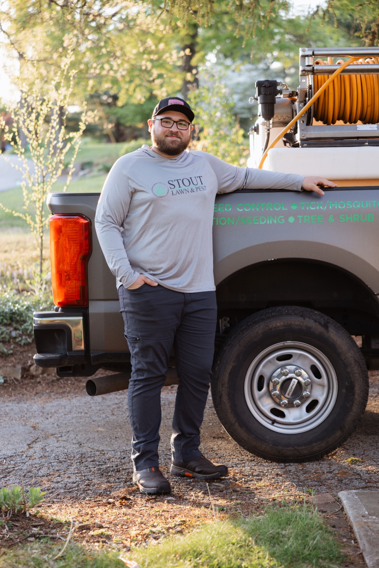 Stout Lawn & Pest team portrait by the truck